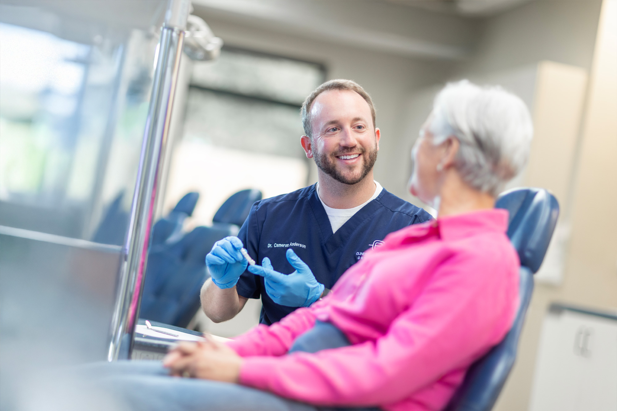 Invisalign patient looking in mirror